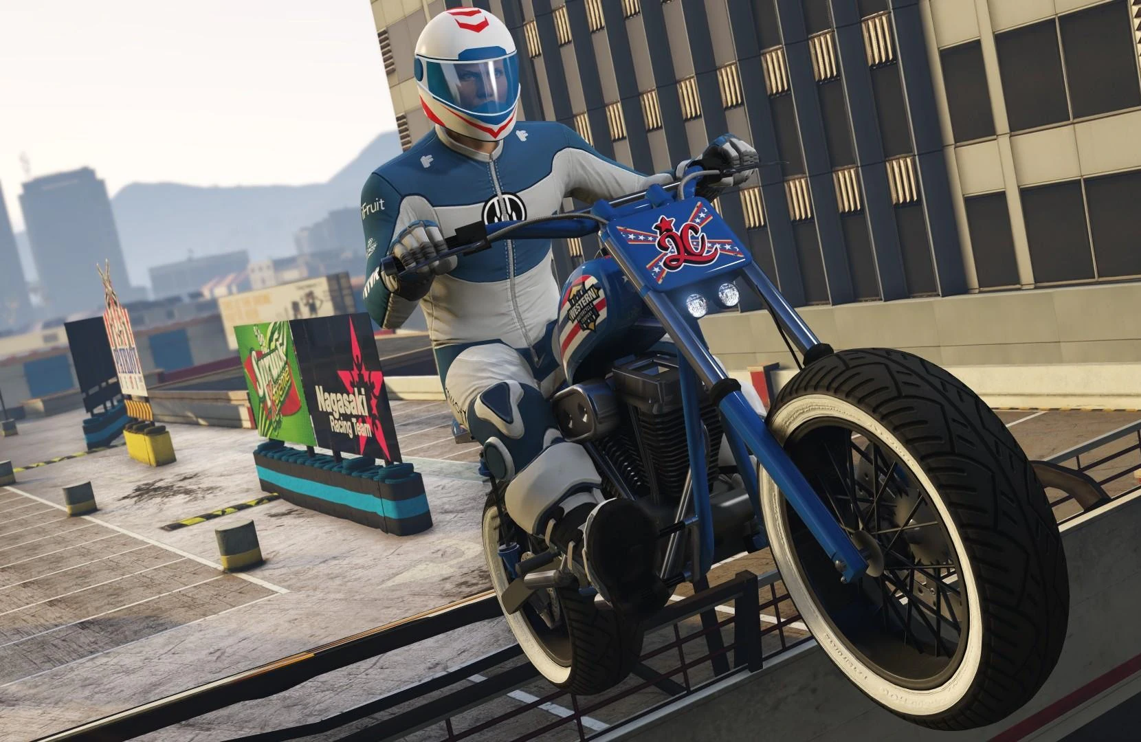 A motorcycle performer in full safety gear rehearsing on a practical rooftop ramp
