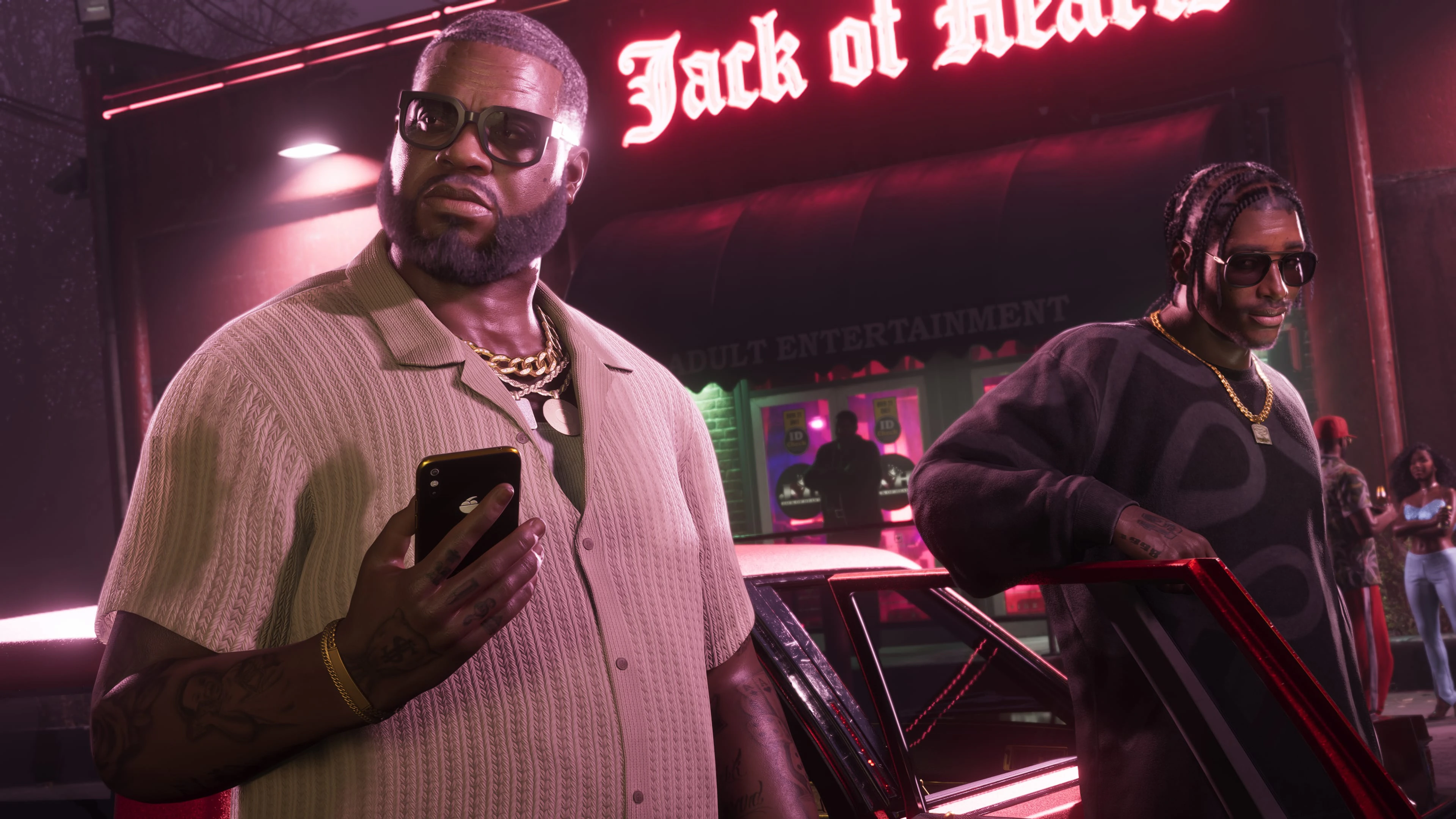 Two adult men arriving outside a neon adult entertainment club