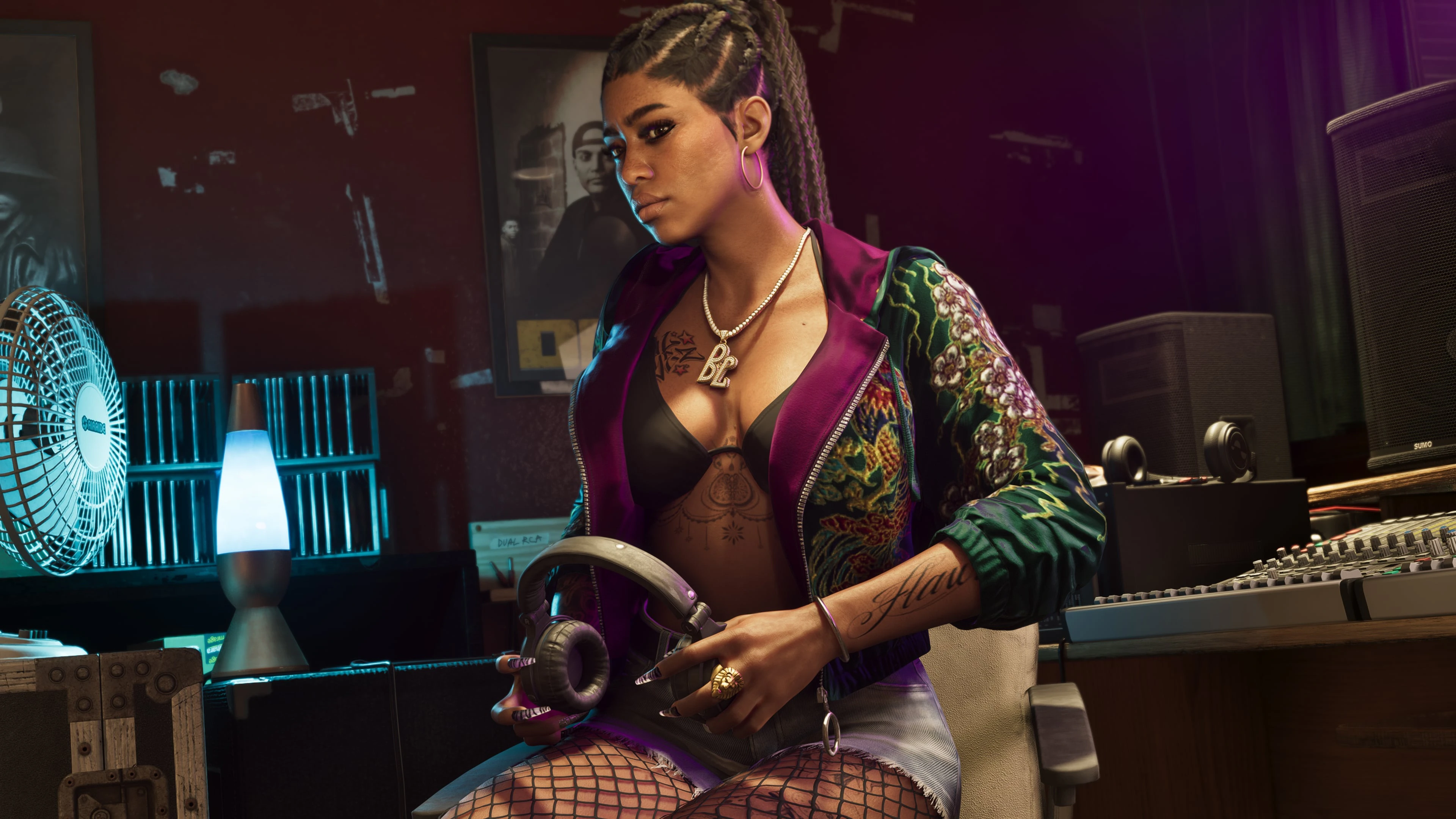 An adult recording artist in patterned streetwear and fishnet hosiery inside a private studio