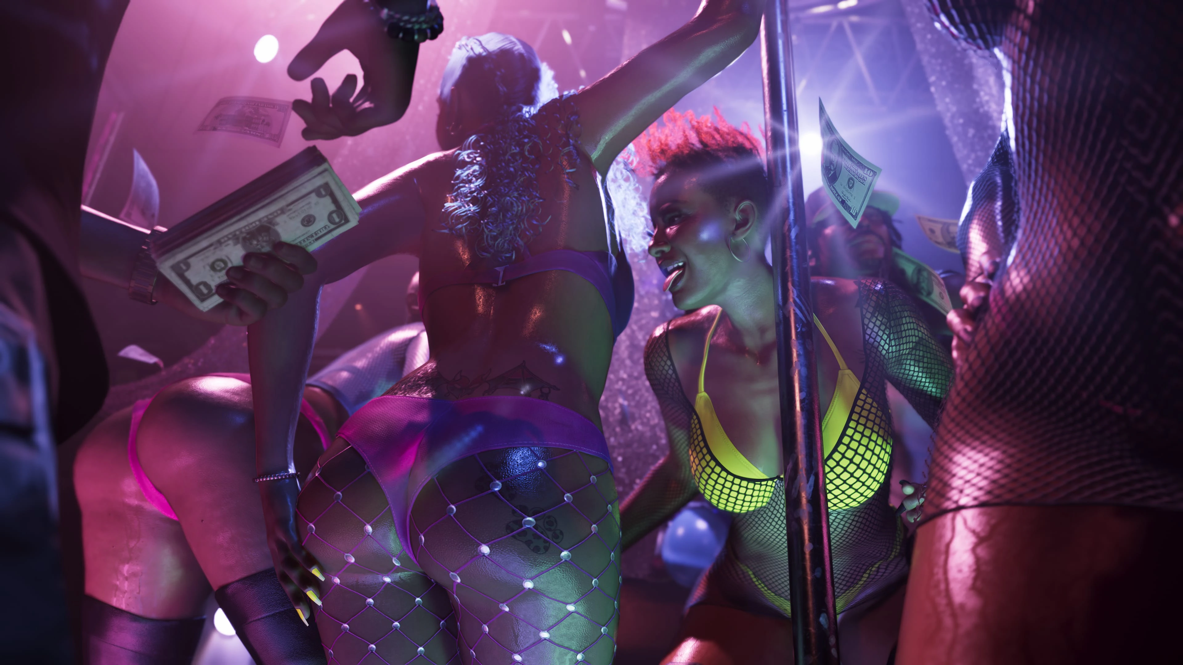 Adult dancers performing around a chrome pole under violet nightclub lights